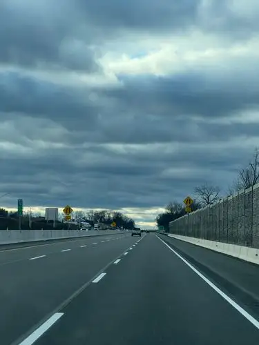 Miles of open road under a dramatic sky.